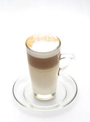 Hot latte coffee in a clear glass, white background