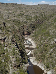 View of the Yuspe river running through the mountains at Cerro Blanco reserve, near Tanti and Los Gigantes, Cordoba, Argentina