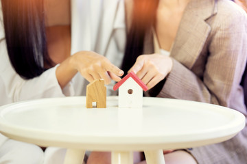 Real estate problem with realtor, lawyer or architect, clients having claim about house construction.business meeting choose the design for built.