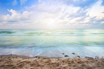 Beautiful Sunset over and Wave of the sea on the sand beach the horizon at Hat chao lao beach in Chanthaburi Thailand.