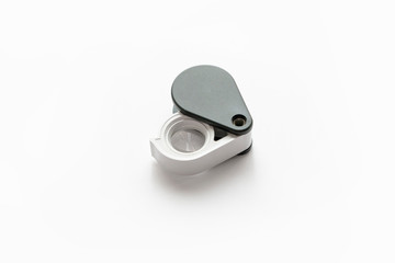 Magnifying glass for diamonds or see the amulet Isolated on a White Background.