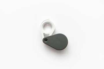 Magnifying glass for diamonds or see the amulet Isolated on a White Background.