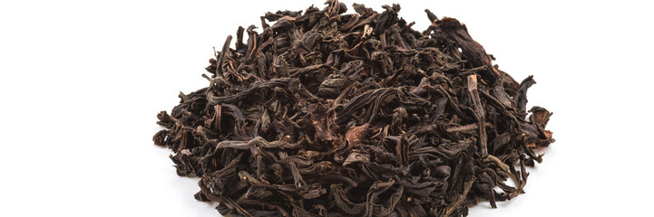 Dried tea poured a slide on a white background. Is isolated.