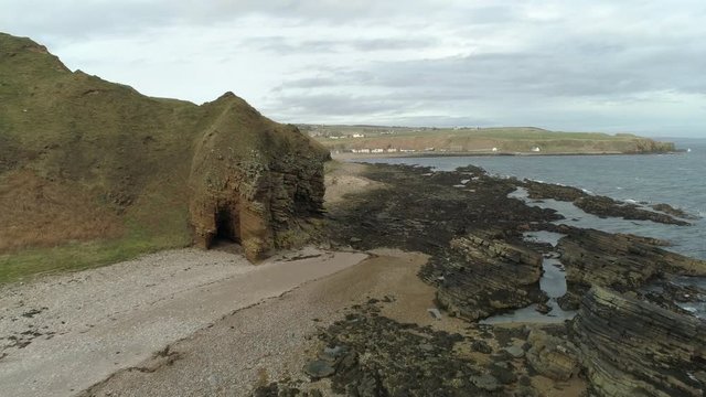 Aerial view across the rocky coastal area heading towards Dunbeath, Caithness, Scotland