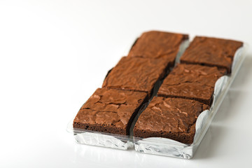 Close up sweet chocolate brownie on white background