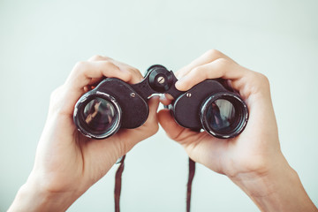 man holding binoculars