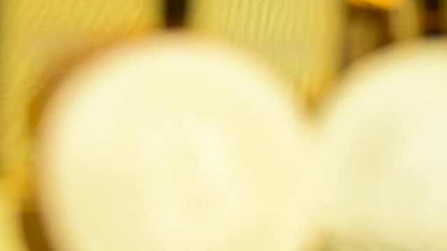 Zoom in and out slow motion shot of front bit coins in front of many golden bricks or blocks