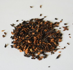 Honeybush Loose Tea against white background. Herbal tea.