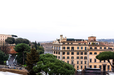Fototapeta na wymiar view of Rome with hill on cloudy day, buildings, pine trees,