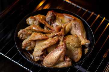 Fried chicken from the oven. Chicken wings, legs grilled