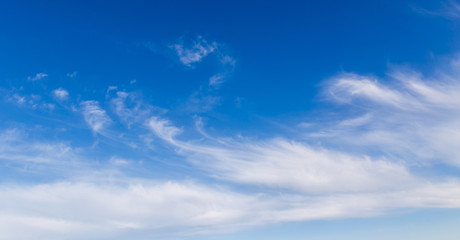 Clouds against the blue sky as a background