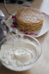 whisking mixer white butter cream to assemble the cake on the occasion
