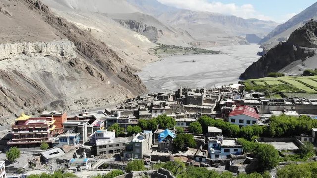 Aerial view of Kagbeni and the mountain valley in the Himalayas. Old houses and agricultural fields. Upper Mustang. Nepal.