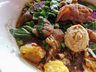 A Thai Beef Noodle Soup image close up.