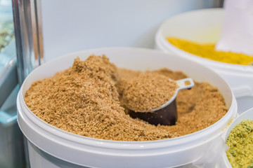 Plastic basket full of spice at the market.