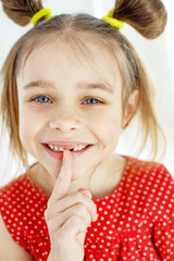 Fototapeta premium The child lost a tooth
