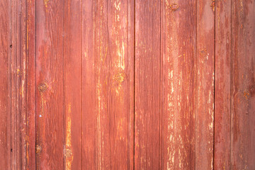 Orange brown vintage wood background texture with knots, old paint and nail holes