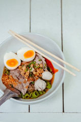 Thai Street food - Thai pork noodle with spicy sauce and boiled eggs