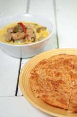 Indian roti with Thai green curry top view shot