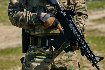 Fototapeta premium Armed soldier ready for battle. Military concept.