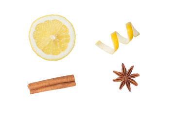 Longitudinal section of lemon and lemon peel chips. Cinnamon stick and anise star. Isolated on...