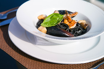 Spagetti with seafood on a plate.