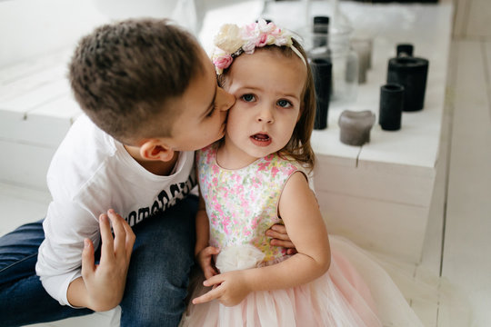 Two Caucasian Siblings Brother And Sister Posing For Picture During Family Photo Shooting