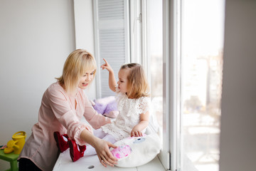 Beautiful young mother with her daughter