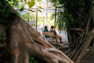 Couple sitting on the swing