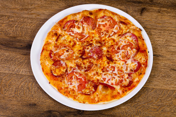 Pepperoni pizza with sausages