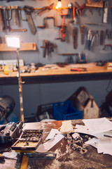 Tools and sketches in a old retro vintage workshop / garage.