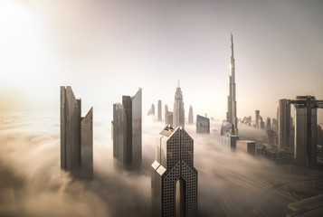 Cityscape of Dubai Downtown skyline on a foggy winter day. Dubai, UAE.