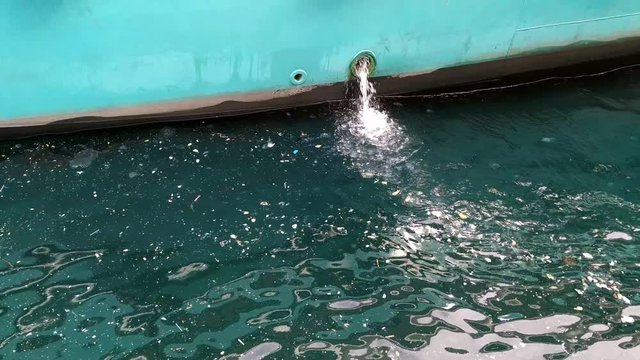 Boat Discharges Waste Into Water