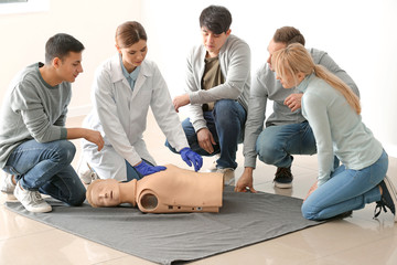 People learning to perform CPR at first aid training course