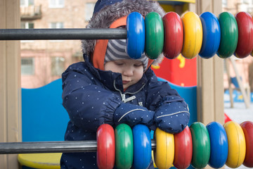 Fototapeta na wymiar little boy walking on the Playground