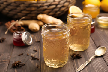 Glasses of tasty drink on wooden table