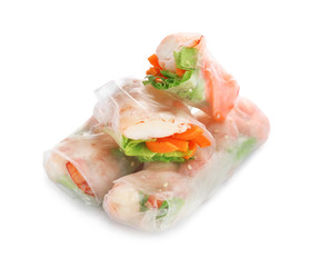 Tasty spring rolls on white background