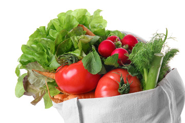 Eco bag with products on white background, closeup