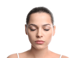Fototapeta premium Beautiful young woman with eyelash extensions on white background