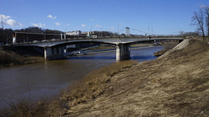 Naklejka premium bridge, landscape, morning on the river, river, fortress wall, city, water, early spring on the river