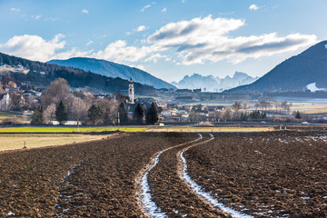 Brunico. Country of Teodone and the Dolomites in the background. Winter