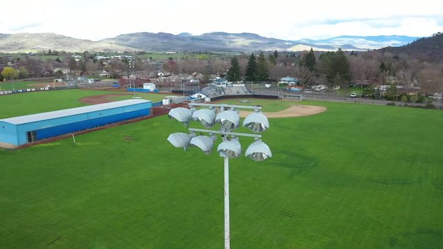 Aerial view of stadium lights with baseball and softball fields in the background.