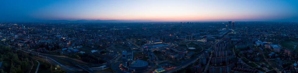 Milan panoramic skyline at dawn, aerial view.