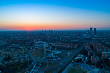 Milan panoramic skyline at sunrise, aerial view.