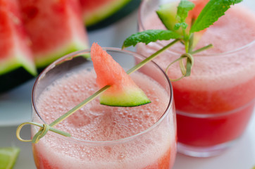 Watermelon smoothie  with lemon and mint to cool down on hot days. Refreshening fruit drink  for hot summer days.
