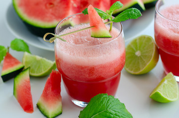 Watermelon smoothie  with lemon and mint to cool down on hot days. Refreshening fruit drink  for hot summer days.