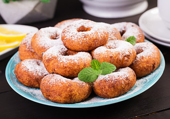 Brunch or lunch. Homemade donuts sprinkled with powdered sugar.