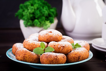 Brunch or lunch. Homemade donuts sprinkled with powdered sugar.