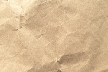 Fototapeta premium Brown crumpled paper texture background.