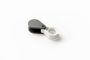 Magnifying glass for diamonds or see the amulet Isolated on a White Background.